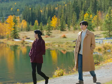 Ho-jin quietly following Mu-hee by a peaceful lakes, representing that love grows stronger when built on patience and trust