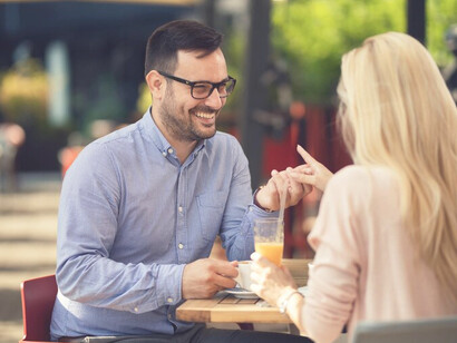 The essence of relationships and love as a happy couple enjoys coffee, communicates, and relaxes in a cozy cafe, embodying empowerment and meeting expectations