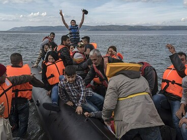 Syrian and Iraqi refugees arriving by boat at Skala Sykamias, Lesvos, Greece