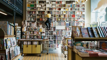 A person selecting their next novel to read