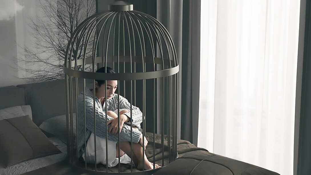 A woman practicing self-restraint lies in a bed cage, demonstrating control in a confined space