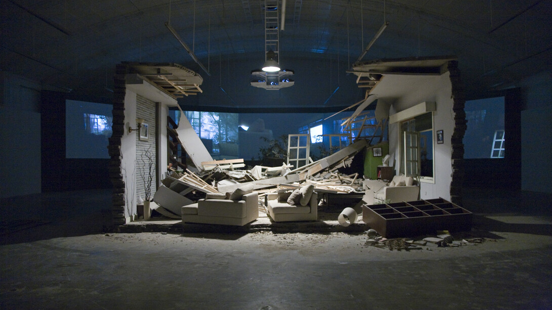 Zhang Peili, A Gust of Wind (Zeng feng) (2008). Five-Channel/five-screen video projection (PAL), silent/colour, 13’14” with objects preserved from the film set destroyed during shooting, dimensions variable. © Boers-Li Gallery, Beijing. Courtesy of the artist and Boers-Li Gallery
