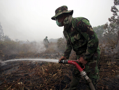 Indonesia sends troops to fight fires as haze cloaks South-east Asia