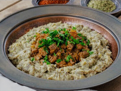 On a traditional dish, a mouthwatering Hünkar Beğendi captivates the eyes with its irresistible appeal
