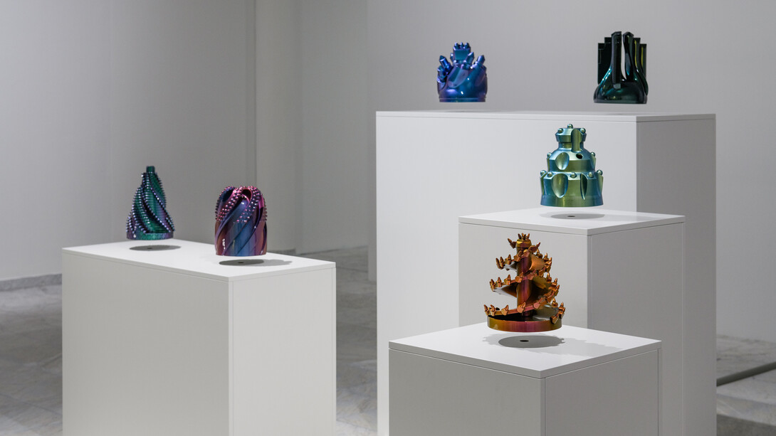 Monira Al Qadiri, OR-BIT 1-6 (2016-18). 3D printed plastic, automotive paint, levitation module, Approx. 30 x 30 x 30 cm each. Courtesy of the artist. Photo: Markus Johansson