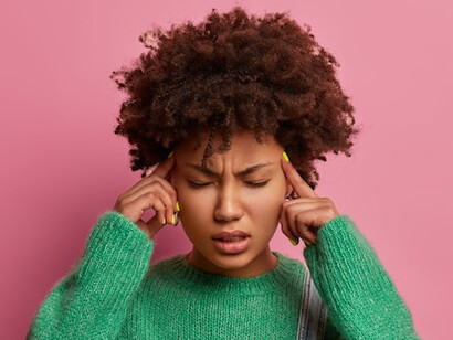 The young woman stands in a moment of quiet reflection, embodying the disappointment of a setback, but also the realisation that failure is not the end, it's part of the journey