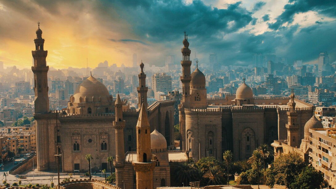 Cairo's historic mosques rising above the city skyline in Cairo, Egypt, representing architecture as a lasting expression of institutional identity and cultural heritage