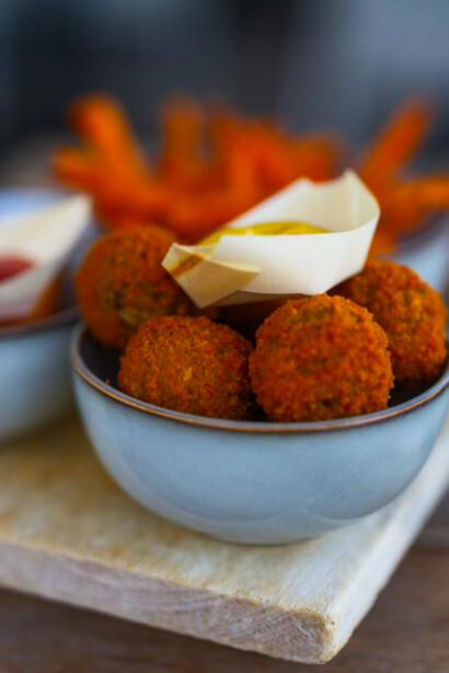 A bowl of bitterballen with a small Dutch flag proudly placed on top