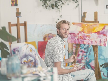 A passionate artist in his studio. The purpose is the motivational force behind emotions, whereas passion is what delights you and ignites a fire of emotions within you