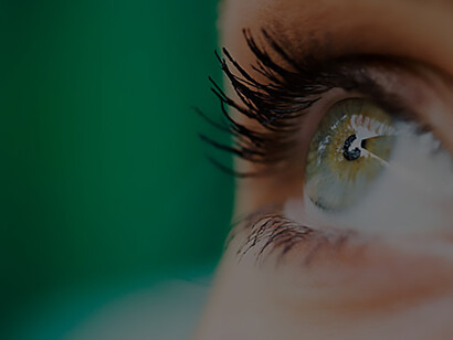 Engage with the dynamics of perception, perspective, and human senses through a close-up photograph of a young woman's eyes