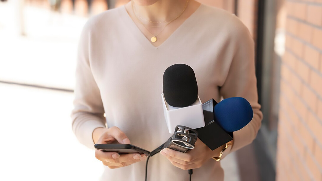 A woman holding a microphone, representing her role as a journalist or media personality