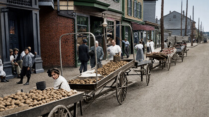 Street peddlers selling goods in Boston, USA, around 1915