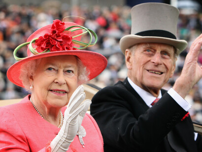 Queen Elizabeth and Prince Philip on carriage