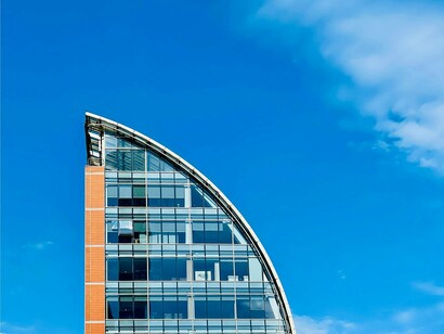Modern skyscraper that exhibits the rapid growth of technology in a world that seems to be increasingly centered on everything that's new