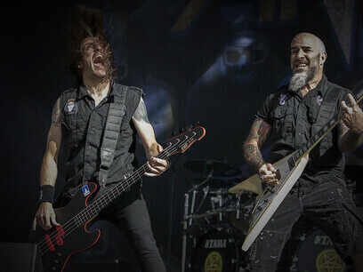 Anthrax's guitarist Scott Ian and bassist Frank Bello playing a powerful riff on stage