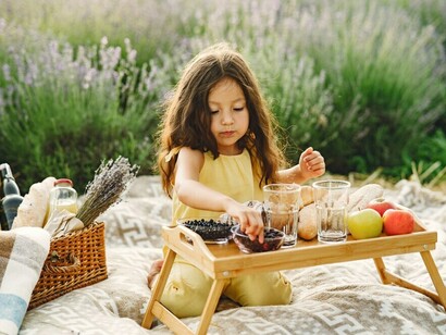 A child participating in a Zero Waste picnic, turning leftovers into delicious dishes as part of the Zero Hunger movement