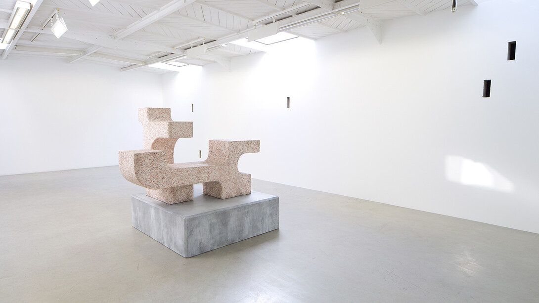 Valentin Carron - Un mur cinq trous, 2014, 5 arrow loopholes, concrete, painting, wood, Variable dimensions - Ravage with granite (after André Tommasini), 2014, Polystyrene and resin, 147 x 162 x 130 cm, View of the exhibition « L’autoroute du soleil à minuit », kamel mennour (47, rue Saint-André des Arts), Paris, 2015 © Valentin Carron, Photo: Fabrice Seixas, Courtesy the artist and kamel mennour, Paris
