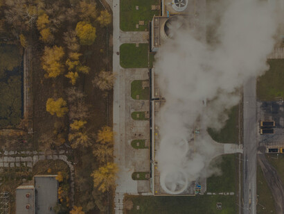 Factory emitting white smoke in Poznań, Greater Poland Voivodeship, Poland, illustrating industrial emissions