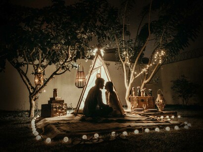 A couple in a teepee at night; if the contradictions are not neutralized if they are not denied, but rather experienced, enabling change