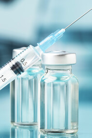 A poignant still life capturing the essence of the ongoing battle against COVID, featuring the symbolic presence of a vaccine