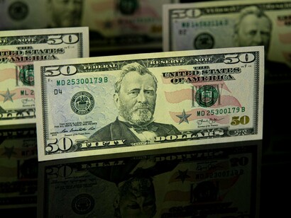 Stacks of bills on a table, conveying how monetary motives are often behind most governance failures