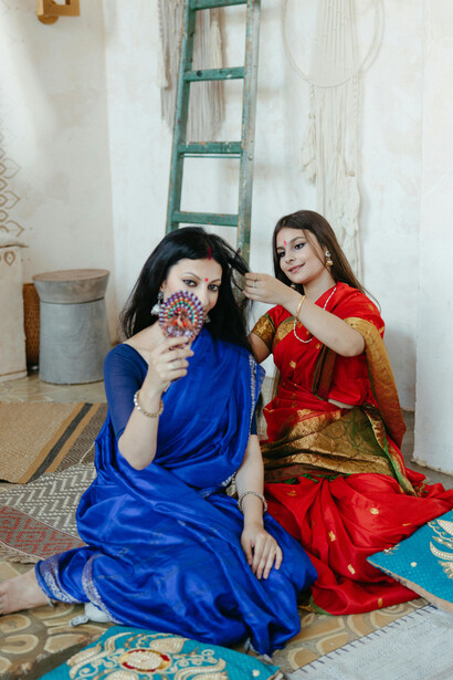 Women wearing traditional Indian sarees, including Banarasi silk sarees