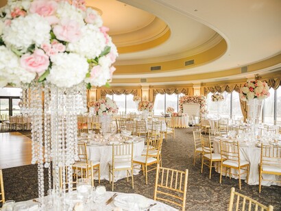 A beautifully decorated wedding venue adorned with elegant flower bouquets