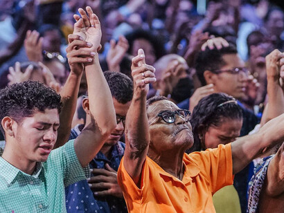 The energy in the room is palpable as congregants engage in a collective celebration of spirituality, a reminder of the deep human need for belonging