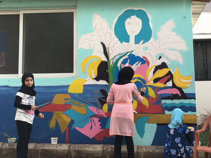 Children painting a wall