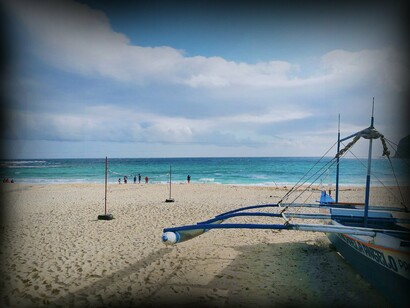Scenic view with boat  in Saud Beach, Pagudpud, Philippines 