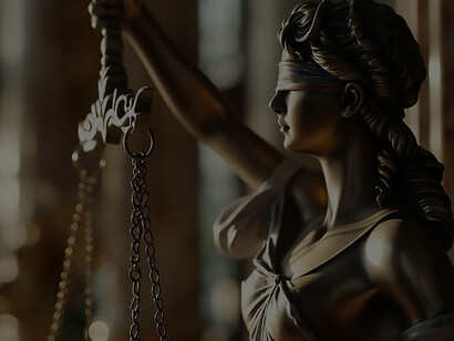 Themis, with a blindfold adorning her eyes, elegantly clasps a scale, embodying the principles of impartiality and equitable judgment in her iconic portrayal