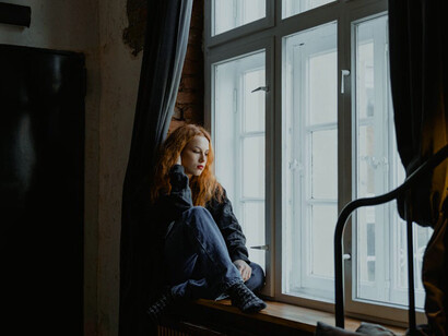 Gazing out the window, she reflects on how putting her thoughts on paper helps transform her inner chaos into clarity