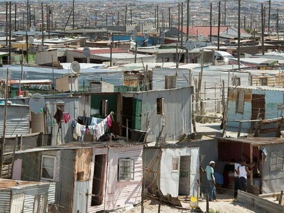 Khayelitsha and shakes where people live in poor conditions, a township close to Cape Town, South Africa