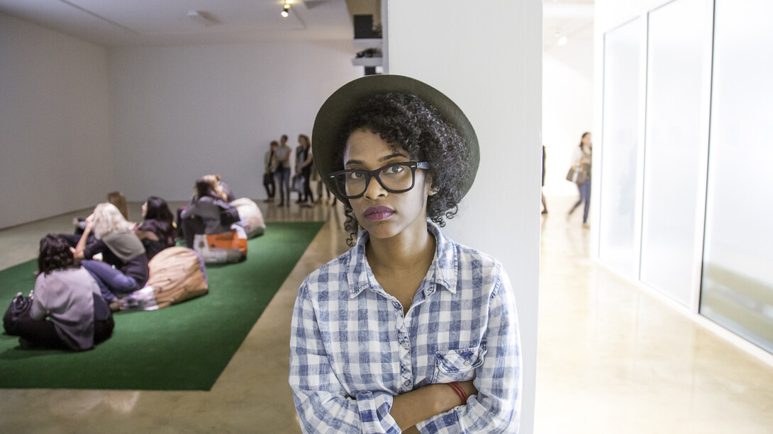 Tameka Norris, standing in the midst of her exhibition Meka Jean: Recovery at Emerson Dorsch. Courtesy Emerson Dorsch. Photo by Monica McGivern