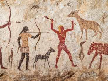 Cave paintings and reconstructions of prehistoric social groups depicting early human society