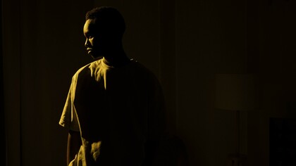 Person standing alone in the dark 