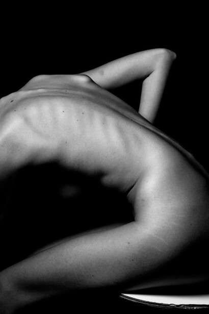 Grayscale images of nude bodies often reveal the vulnerability behind body image issues, reflecting how social media imposes unrealistic beauty standards