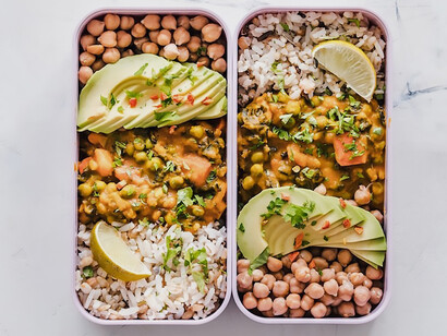 A carefully arranged tray displays a sumptuous assortment of freshly cooked dishes, showcasing a thoughtfully prepared lunch meal