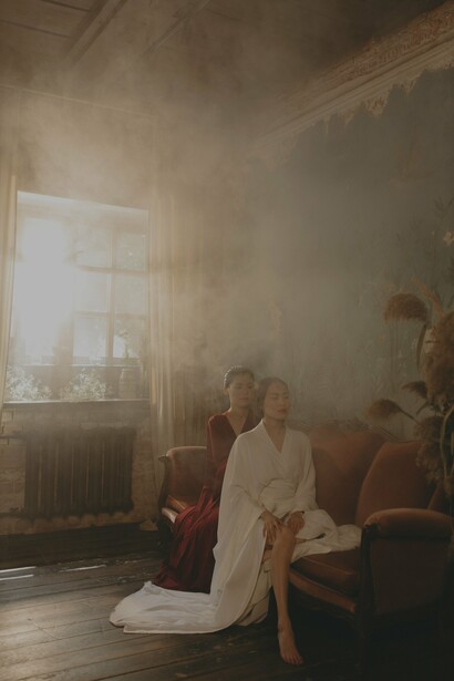 A woman dressed in red and a woman dressed in white 