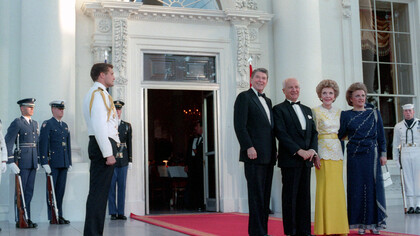 President Ronald Reagan, First Lady Nancy Reagan, and Turkish President Kenan Evren, along with Senay Gurvit, pose on the North Portico before a state dinner on June 27, 1988