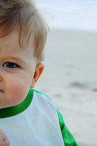 A meme of a baby making a fist, often used to humorously convey determination or a playful attitude