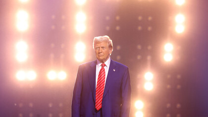 Trump stands motionless, a symbol of the isolationist path he's chosen, turning his back on global leadership at a time when the world needs unity