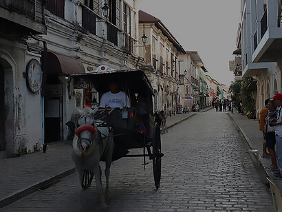 Explore the cultural richness of Vigan's Heritage Village along Calle Crisologo and Gen Luna, accompanied by the timeless charm of a Kalesa, showcasing Philippines' heritage and history