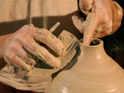 An artist paying close attention to detail hoping to make the perfect creation in their image