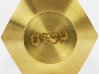 Anthropocene spike, a golden spike driven into a rockface to mark the beginning of the Anthropocene geological era. © Victoria and Albert Museum, London