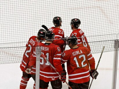 Canada's Duncan Keith (#2, left), Rick Nash (#61, center), Jarome Iginla (#12, right), Dan Boyle (#22, back left), and Sidney Crosby (#87, back right) celebrate a goal against the United States during the 2010 Winter Olympics
