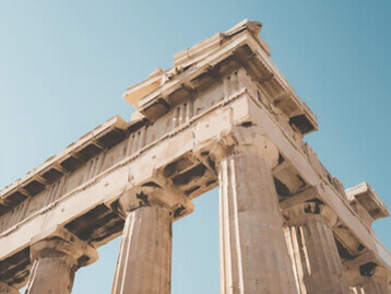Explore the sunlit ruins of ancient Athens, where the iconic Erechtheion building stands as a testament to Greek antiquity—an unmissable destination for history enthusiasts and sightseers