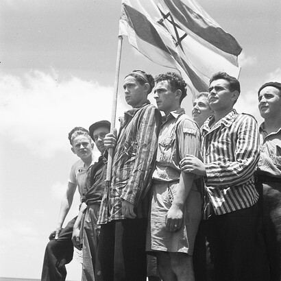 The image of Buchenwald survivors arriving in Haifa on July 15, 1945, only to be arrested by the British vividly captures a tragic moment in history. After enduring the horrors of the Holocaust, these survivors were met with further hardship as they were detained by the British authorities, who were trying to restrict Jewish immigration to Palestine