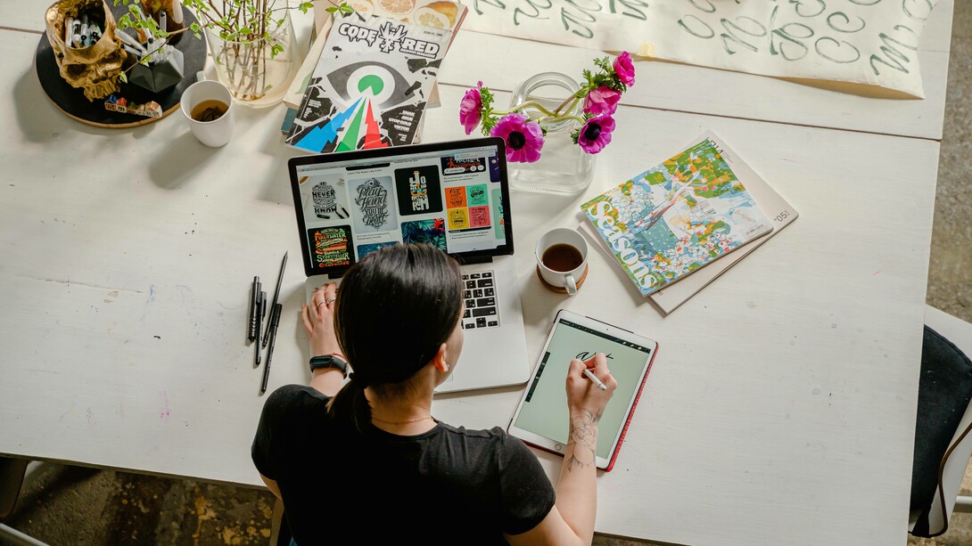 A bachelor of arts student working hard on a project while trying to find a job