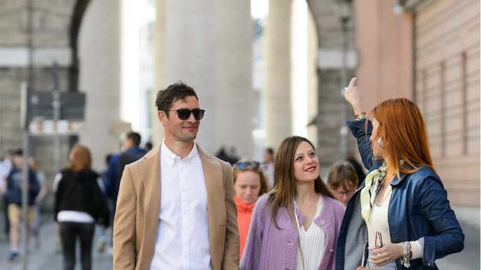 Photojournalist and licensed tour guide Eva Soproni with her private clients, Vatican City